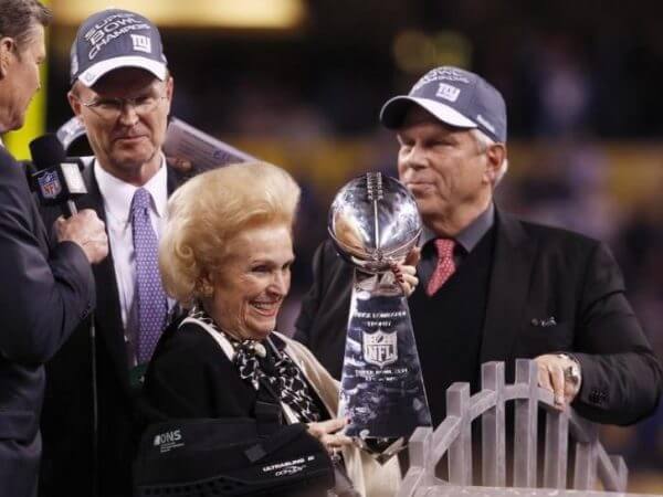 New York Giants owners Steve Tisch and John Mara celebrate their team's win with Mara's mother Ann Mara at the end of the NFL Super Bowl XLVI football game in Indianapolis